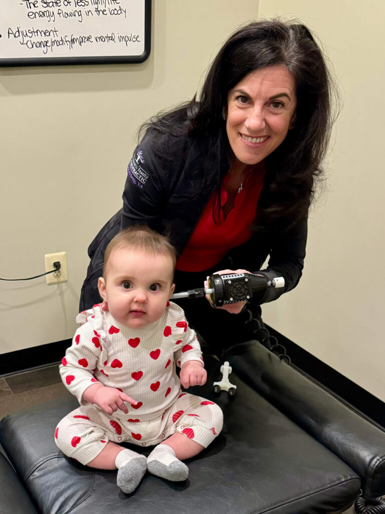 Dr. Christine Stewart giving baby girl pediatric care treatment